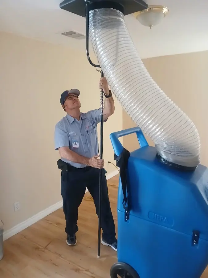 Furnace Tune-Up technician using HEPA equipment in Spring Hill